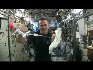 what happens if you squeeze a wet towel in space